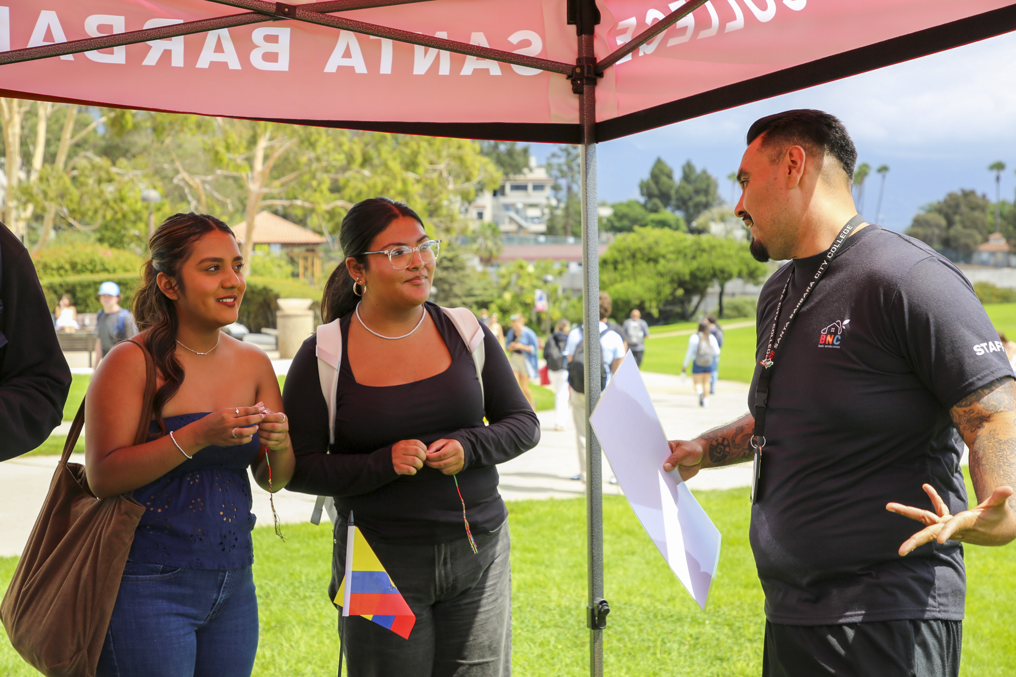 miguel cruz with students at the bnc fair